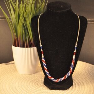 Red and Blue Beaded Necklace with Spiral Design